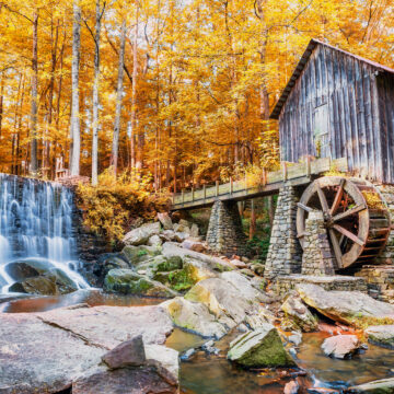 Fall or Autumn image of historic mill and waterfall in GA